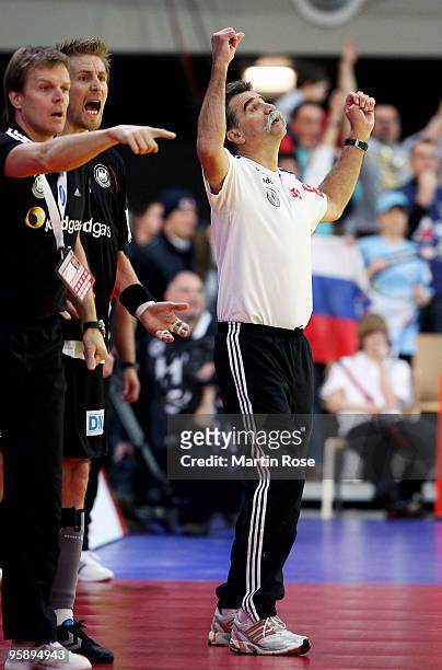 Head coach Heiner Brand of Germany celebrates during the Men's Handball European Championship Group C match between Slovenia and Germany at the...