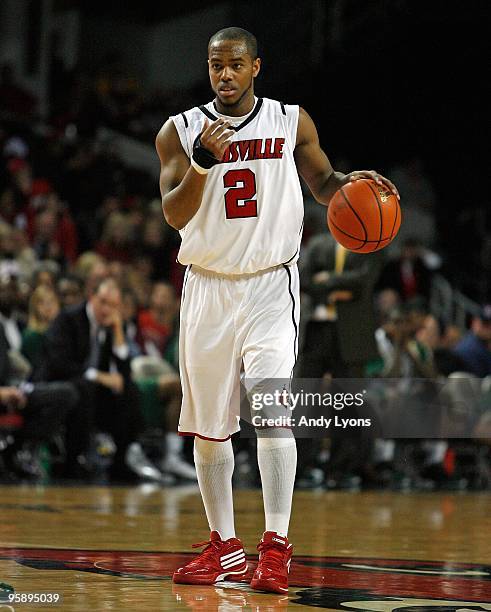 Preston Knowles of the Louisville Cardinals dribbles the ball during the Big East Conference game against the South Florida Bulls on December 30,...