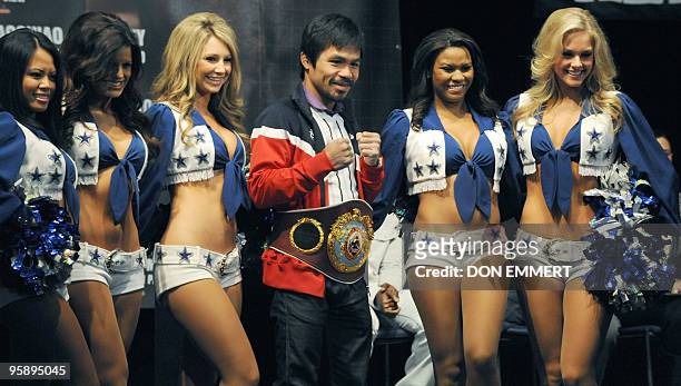 World champion boxer Manny �PacMan� Pacquiao and the Dallas Cowboy cheerleaders pose for pictures during a news conference January 20, 2010 in New...