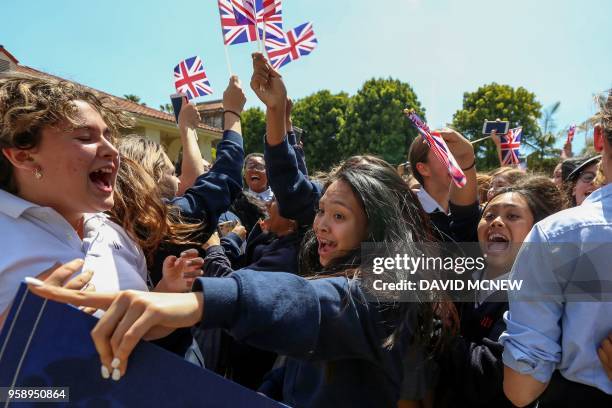 Students at Immaculate Heart High School and Middle school celebrate with British flags during a program to honor alumna Meghan Markle, who is...