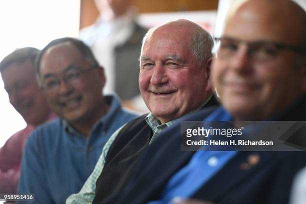 United States Secretary of Agriculture Sonny Perdue, second from right, seated next to Sakata Farms owner Robert Sakata, second from left and...