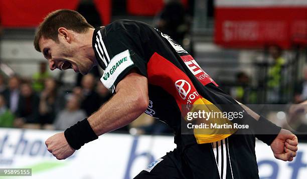 Michael Haass of Germany celebrates during the Men's Handball European Championship Group C match between Slovenia and Germany at the Olympia Hall on...