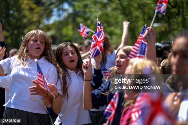 Students at Immaculate Heart High School and Middle school dance and sing with U.S. And British flags during a program May 15, 2018 in Los Angeles to...