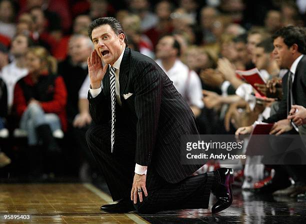 Rick Pitino the Head coach of the Louisville Cardinals gives instructions to his team during the Big East Conference game against the South Florida...
