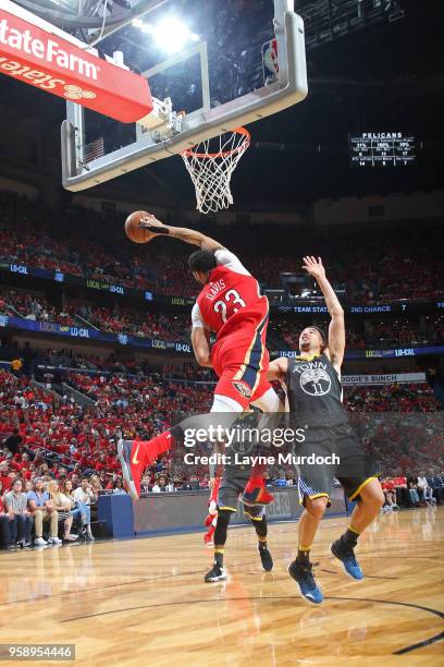 Anthony Davis of the New Orleans Pelicans reaches for control of the ball against the Golden State Warriors during Game Four of the Western...