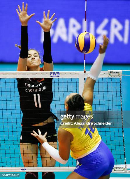 Tandara of Brazil spikes the ball against Louisa Lippmann of Germany during the match between Brazil and Germany during the FIVB Volleyball Nations...