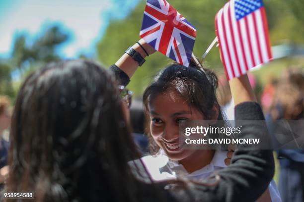 Students at Immaculate Heart High School and Middle school celebrate with US and British flags during a program May 15, 2018 in Los Angeles to honor...