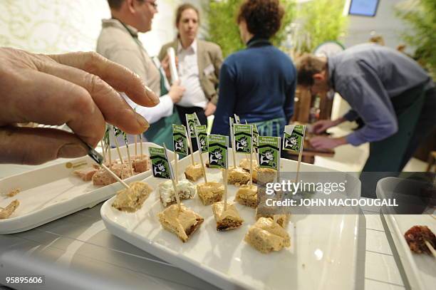 Fair-goers sample spreads from a German organic or "bio" farm at the International Green Week Food and Agriculture fair in Berlin January 19, 2010....