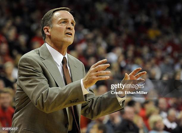 Rebels head coach Lon Kruger gestures to his players during a game against the Utah Utes at the Thomas & Mack Center January 16, 2010 in Las Vegas,...