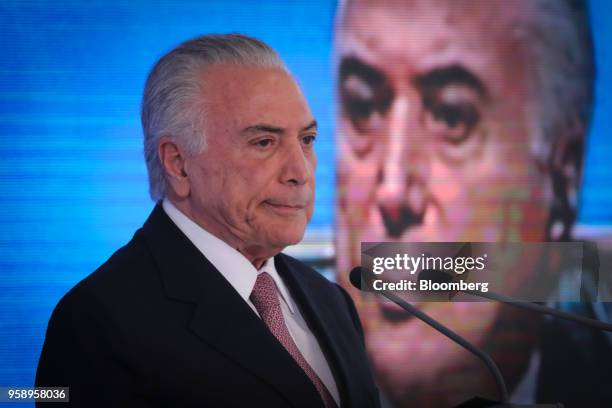 Michel Temer, Brazil's president, pauses while speaking during a ceremony marking his second year in office at the Planalto Palace in Brasilia,...