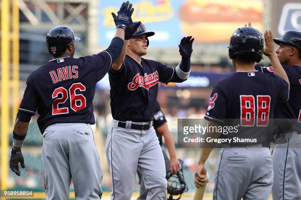 Brandon Guyer of the Cleveland Indians celebrates his first inning grand slam home run with Rajai Davis against the Detroit Tigers at Comerica Park...