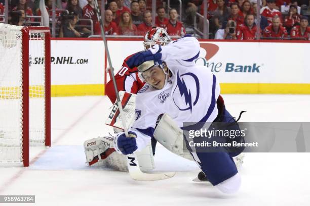 Yanni Gourde of the Tampa Bay Lightning falls to the ice after a tripping call against the Washington Capitals during the first period in Game Three...
