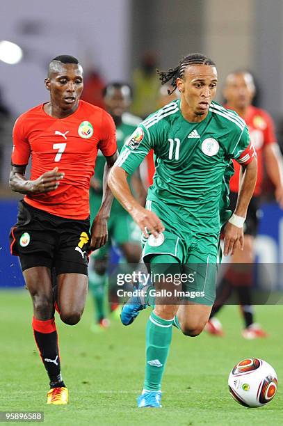 Elias Pelembe of Mozanbique and Peter Odemwingie of Nigeria compete during the African Nations Cup Group C match between Nigeria and Mozambique, at...