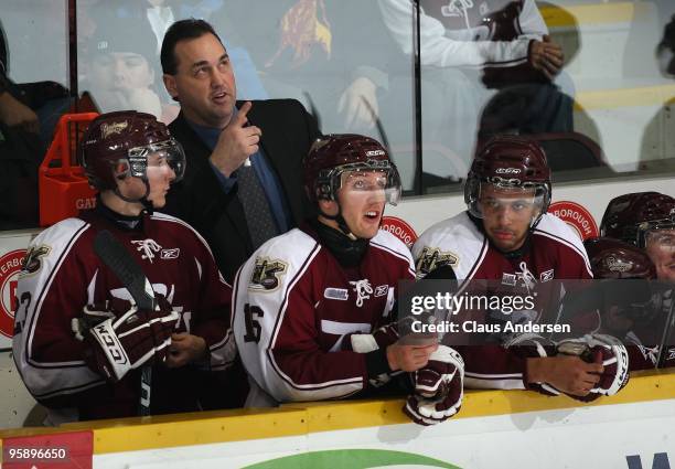 Head coach Ken McRae of the Peterborough Petes points to the score clock in a game against the Belleville Bulls on January 14, 2010 at the...