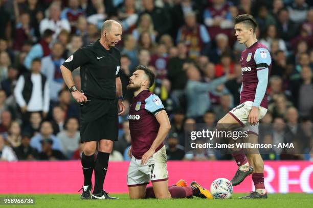 Match referee Mike Dean and Robert Snodgrass of Aston Villa and Jack Grealish of Aston Villa during the Sky Bet Championship Play Off Semi...