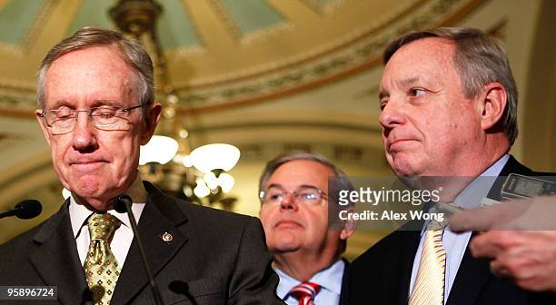 Senate Majority Leader Sen. Harry Reid pauses as Sen. Robert Menendez , and Senate Majority Whip Sen. Richard Durbin look on as they speak to the...