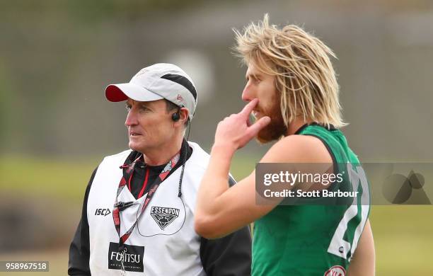 Dyson Heppell of the Bombers and John Worsfold, coach of the Bombers look on during an Essendon Bombers AFL training session at The Hangar on May 16,...