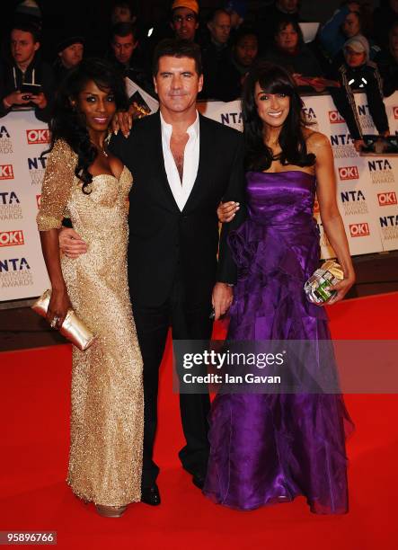 Factor judge Simon Cowell arrives with girlfriend Sinitta and guest at the National Television Awards held at O2 Arena on January 20, 2010 in London,...