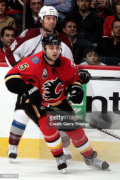 Mark Giordano of the Calgary Flames skates against Darcy Tucker of the Colorado Avalanche on January 11, 2010 at Pengrowth Saddledome in Calgary,...