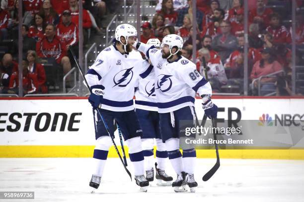 Nikita Kucherov of the Tampa Bay Lightning celebrates with teammate Victor Hedman after scoring a goal against Braden Holtby of the Washington...