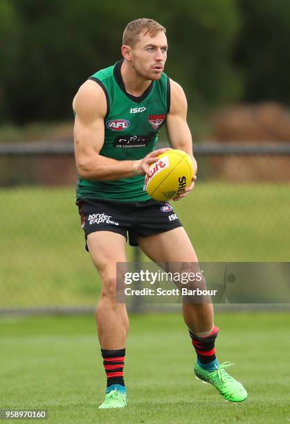 Devon Smith of the Bombers runs with the ball during an Essendon Bombers AFL training session at The Hangar on May 16, 2018 in Melbourne, Australia.