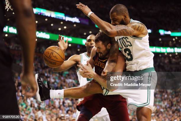 Kevin Love of the Cleveland Cavaliers battles for the ball with Marcus Morris of the Boston Celtics in the first half during Game Two of the 2018 NBA...