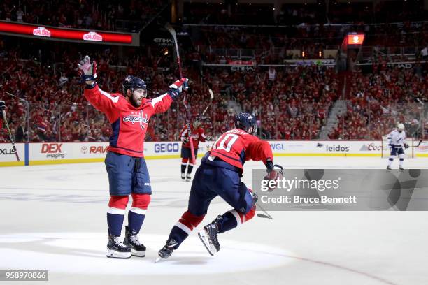 Brett Connolly of the Washington Capitals celebrates with his teammate Chandler Stephenson after scoring a goal on Andrei Vasilevskiy of the Tampa...