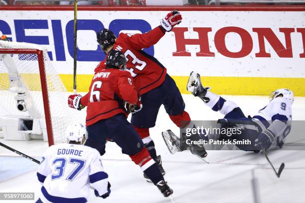 Tom Wilson of the Washington Capitals collides with Tyler Johnson of the Tampa Bay Lightning during the first period in Game Three of the Eastern...