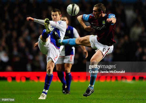 Brett Emerton of Blackburn Rovers battles with David Dunn of Aston Villa during the Carling Cup Semi-Final, second leg match between Aston Villa and...