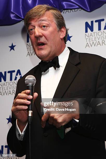 Stephen Fry poses with his most popular documentary award in the press room at the National Television Awards held the at The O2 Arena on January 20,...