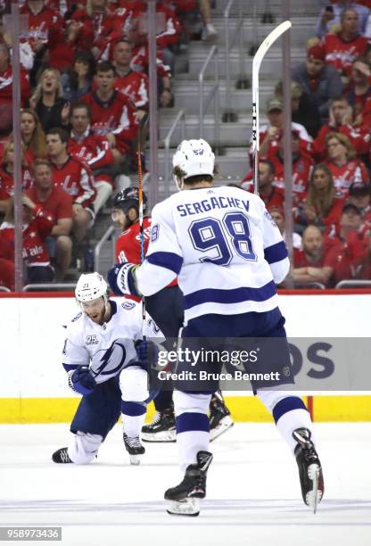 Brayden Point of the Tampa Bay Lightning celebrates with teammate Mikhail Sergachev after scoring a goal on Braden Holtby of the Washington Capitals...