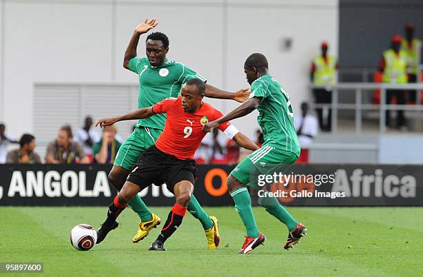 Chinedu Obasi and Obinna Nsofor of Nigeria tackle Tico-Tico Bucuane of Mozambique during the African Nations Cup Group C match between Nigeria and...