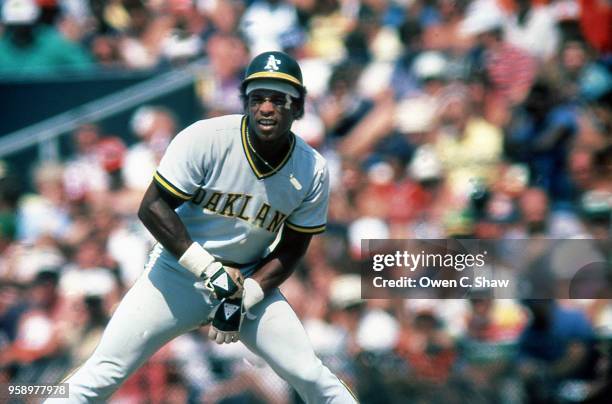 Rickey Henderson of the Oakland Athletics leads off first in a game against the Baltimore Orioles at Memorial Stadium circa 1983 in Baltimore,...