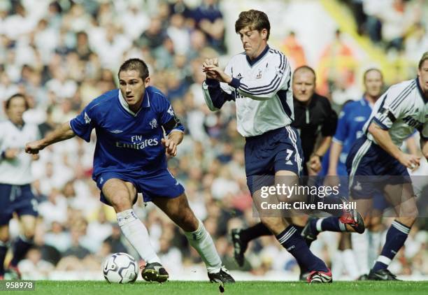 Frank Lampard of Chelsea takes the ball past Darren Anderton of Tottenham Hotspur during the FA Barclaycard Premiership match played at White Hart...