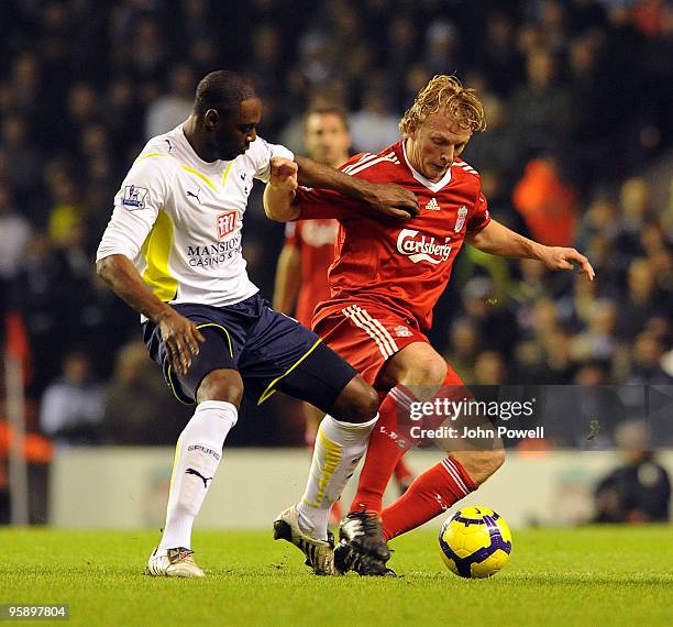 Dirk Kuyt of Liverpool competes with Ledley King captian of Tottenham Hotspur during the Barclays Premier League match between Liverpool and...