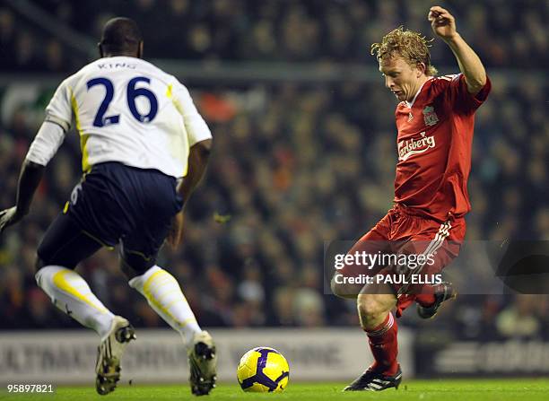 Liverpool's Dutch forward Dirk Kuyt shoots past Tottenham Hotspur's English defender Ledley King to score during their English Premier League...