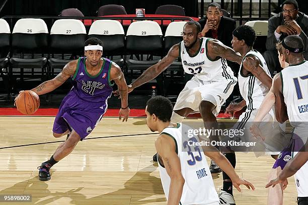 Cheyne Gadson of the Dakota Wizards drives the ball around Doug Thomas of the Reno Bighorns during the D-League Showcase on January 4, 2010 at Qwest...
