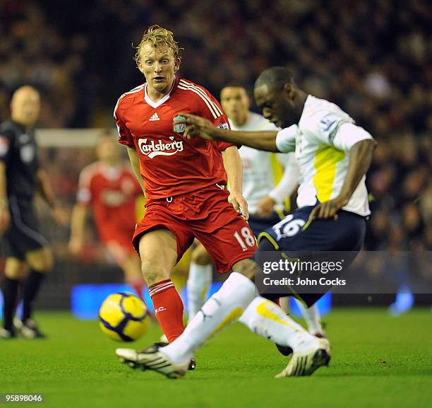 Dirk Kuyt of Liverpool competes with Ledley King captian of Tottenham Hotspur during the Barclays Premier League match between Liverpool and...