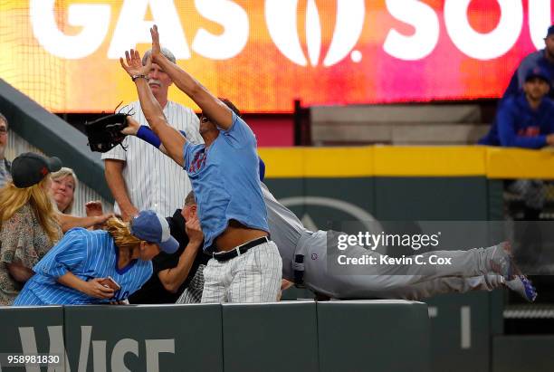 Ian Happ of the Chicago Cubs fails to catch this foul ball hit by Nick Markakis of the Atlanta Braves in the ninth inning at SunTrust Park on May 15,...