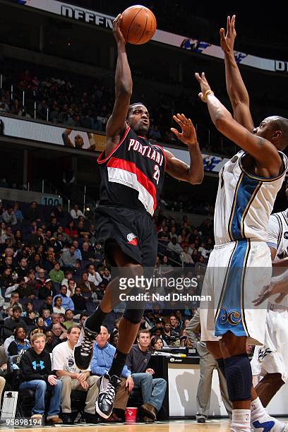 Martell Webster of the Portland Trail Blazers puts up a shot against Caron Butler of the Washington Wizards during the game on January 18, 2010 at...