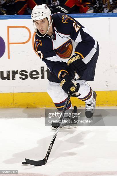 Chris Thorburn of the Atlanta Thrashers skates with the puck against the Florida Panthers at the BankAtlantic Center on January 18, 2010 in Sunrise,...