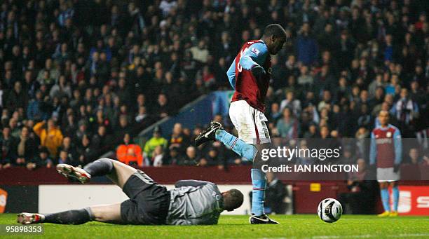 Aston Villa's Emile Heskey goes around the goalkeeper Blackburn Rovers Paul Robinson to score his goal against Blackburn Rovers during the league cup...