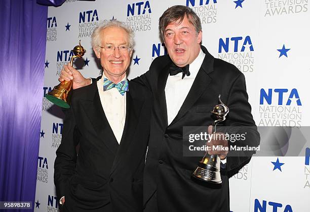 Stephen Fry poses with the award for Best Star Travel Documentary and the Special Recognition Award alongside Bamber Gascoigne during the 15th...