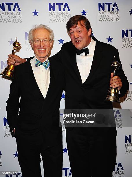 Stephen Fry poses with his Most Popular Documentary award and Special Recognition award with presenter Bamber Gascoigne at the National Television...