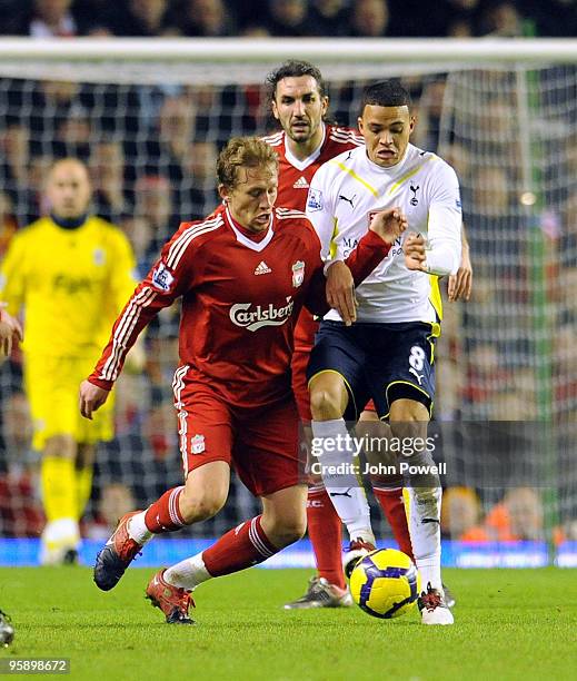 Lucas Levia of Liverpool competes with Jermaine Jenas Tottenham Hotspur during the Barclays Premier League match between Liverpool and Tottenham...