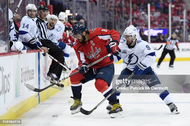 Alex Ovechkin of the Washington Capitals and Tyler Johnson of the Tampa Bay Lightning battle for the puck in the third period in Game Three of the...