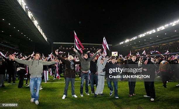 Aston Villa fans run onto the pitch at the final whistle after Aston Villa beat Blackburn Rovers 6-4 during the league cup semi final second leg...