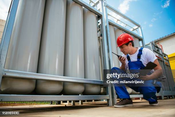 young engineer at work - fueling construction equipment stock pictures, royalty-free photos & images