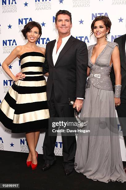 Simon Cowell, Dannii Minogue and Cheryl Cole pose with the most popular talent show award awarded to X Factor in the press room at the National...