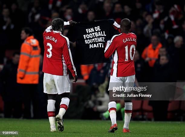 William Gallas of Arsenal and Bacary Sagna of Arsenal hold a shirt in relation to the Haiti earthquake during the Barclays Premier League match...